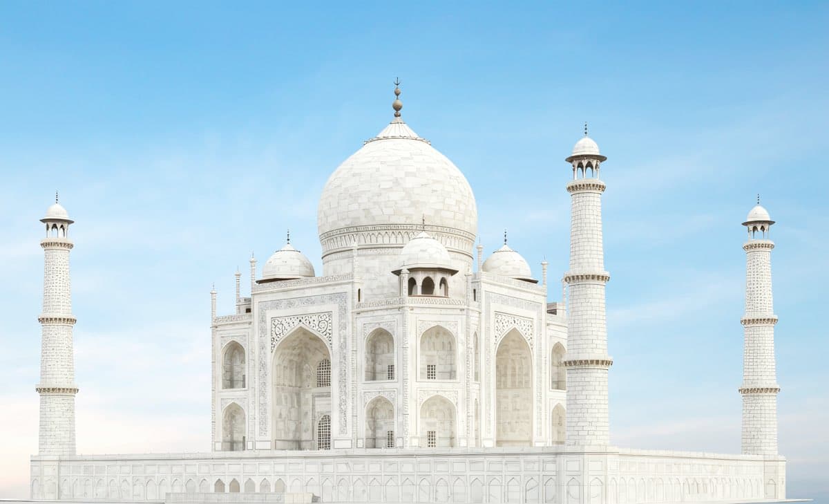 White marble arches against a pale sky